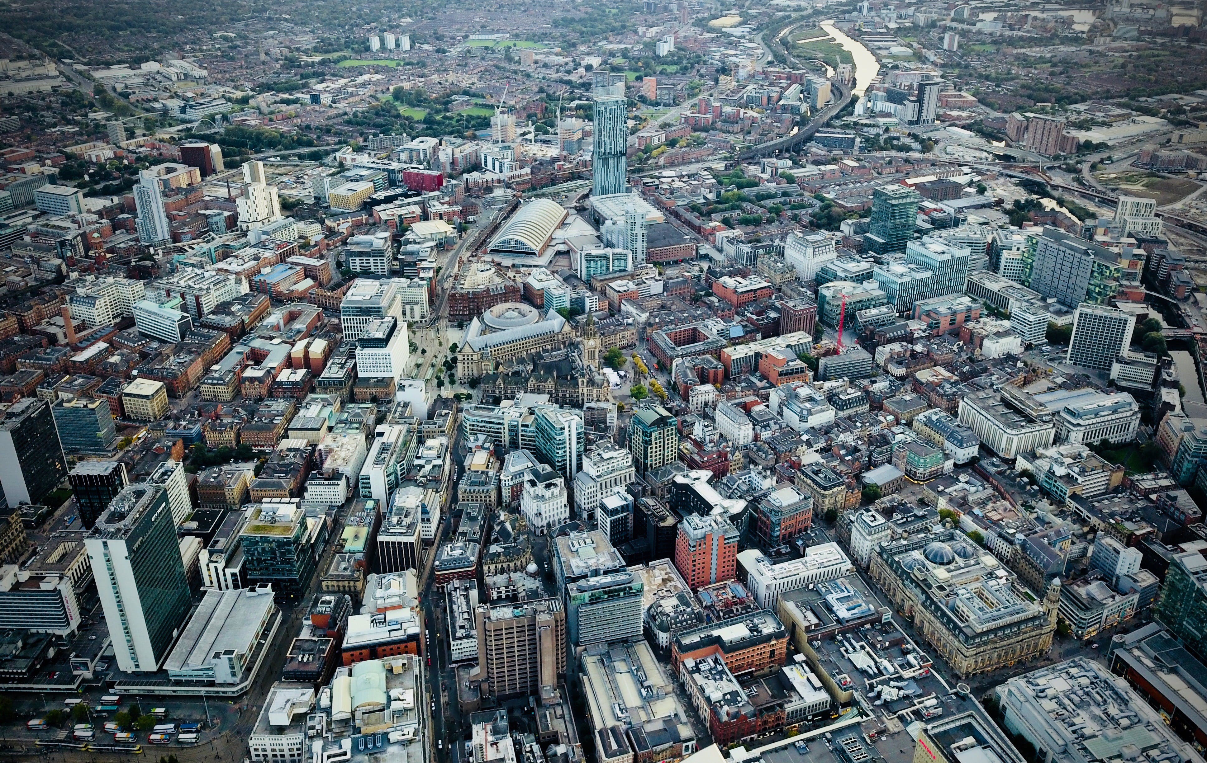 An aerial view of Manchester city centre, showing the buildings from above