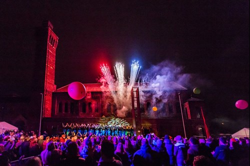 Crowd in front of show with fireworks
