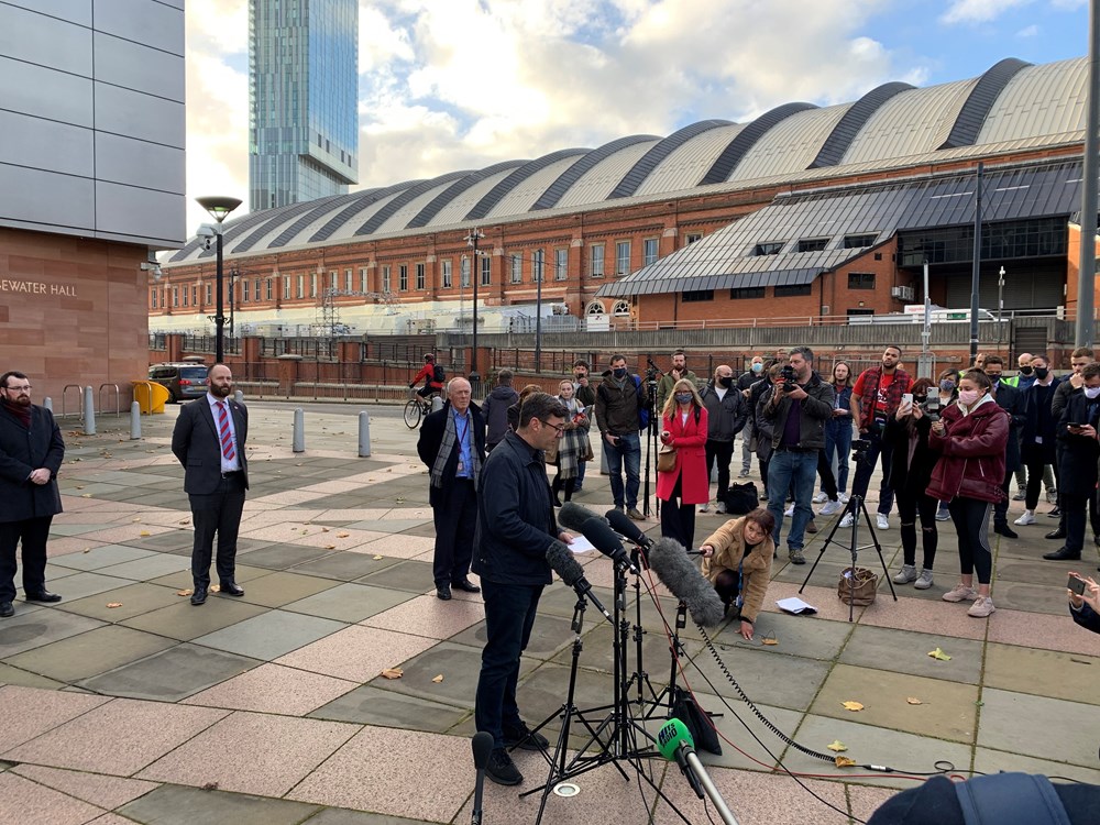An image showing the Mayor Andy Burnham giving a press conference to media following talks with the Government