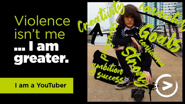 Young boy crouched down with camera with strapline violence isn't me, I am greater, I am a YouTuber