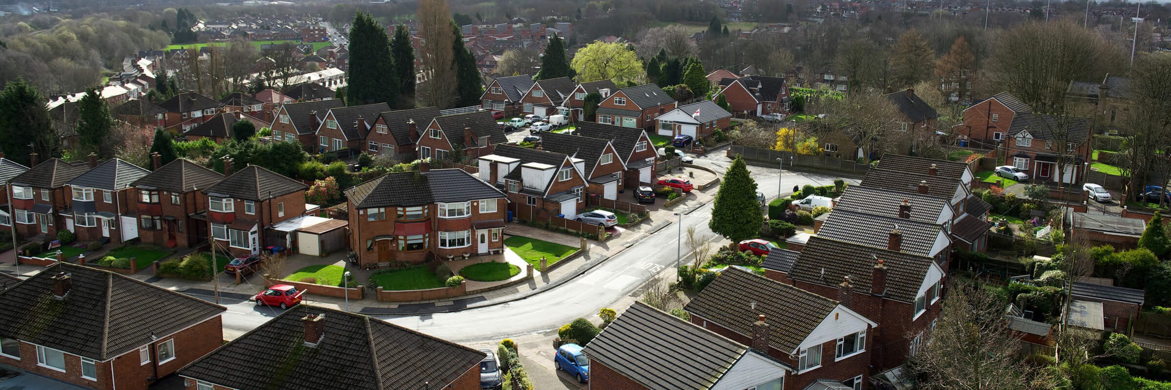 Picture taken from above showing houses on a street.
