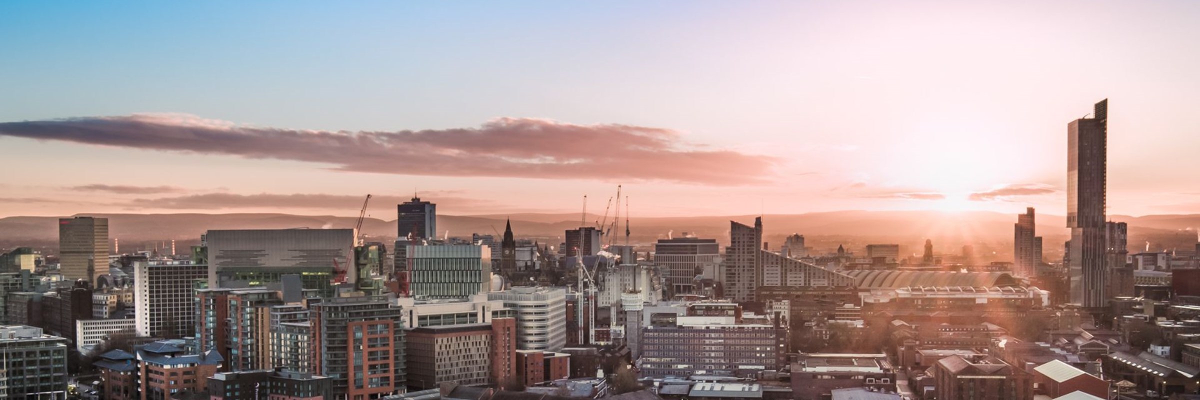 Aerial view of city of Manchester, while the sun is setting