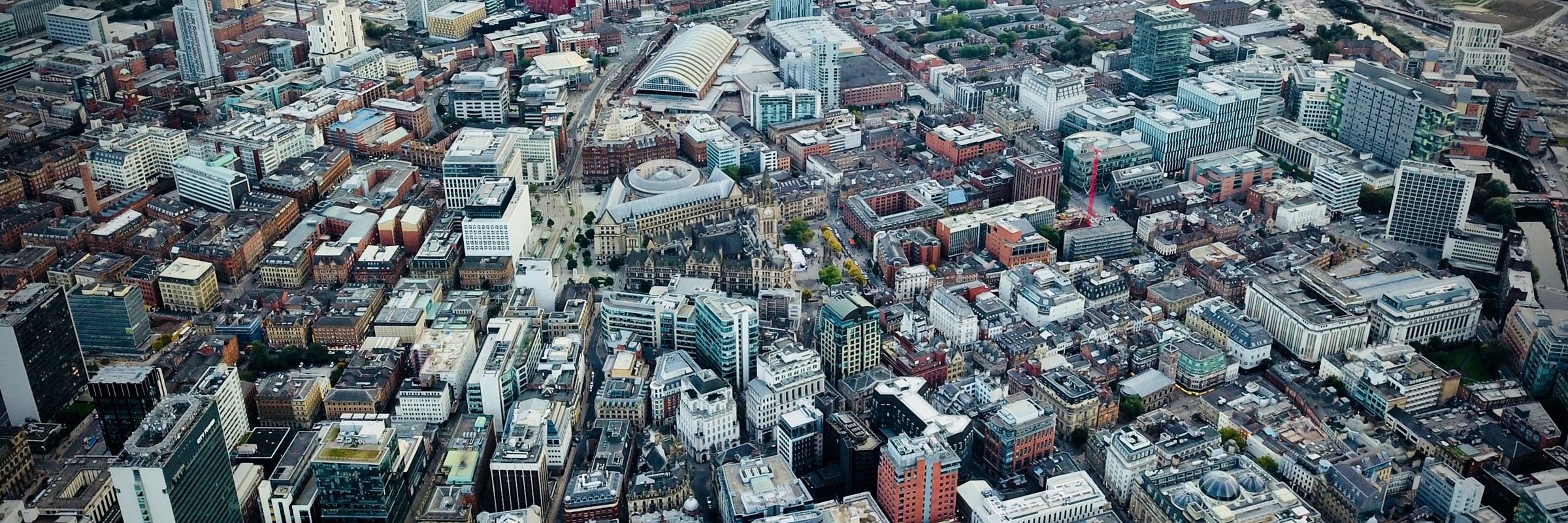 An aerial view of Manchester city centre, showing the buildings from above