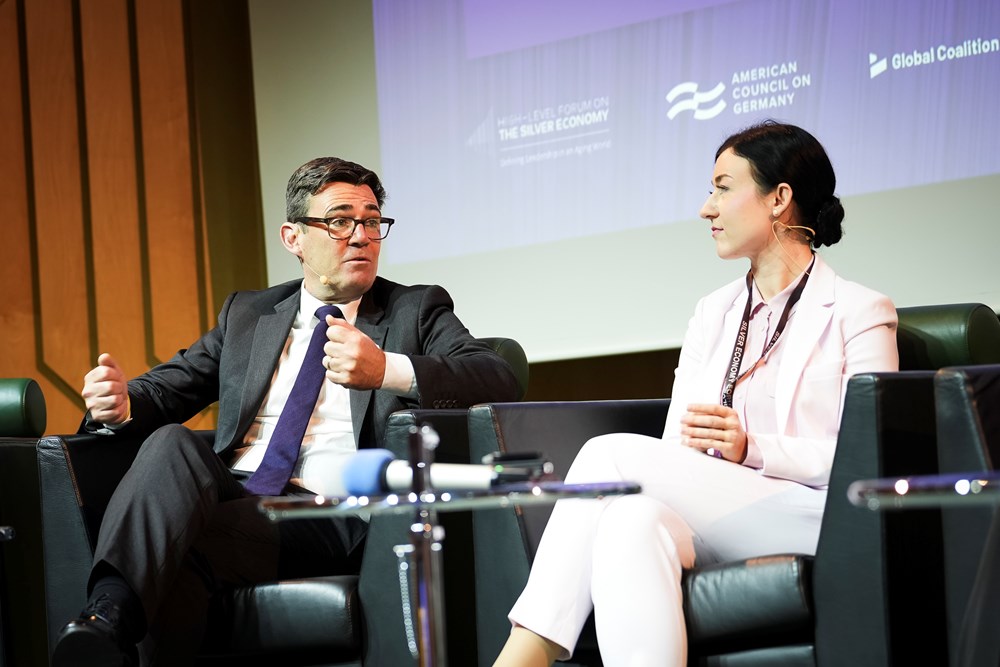 Andy Burnham speaking to Paula Piechotta on a panel