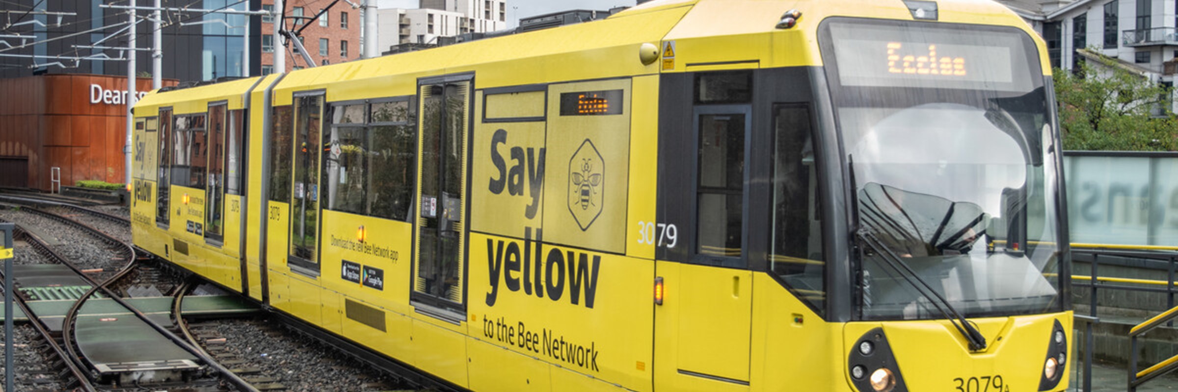 Tram covered in the yellow Bee Network branding