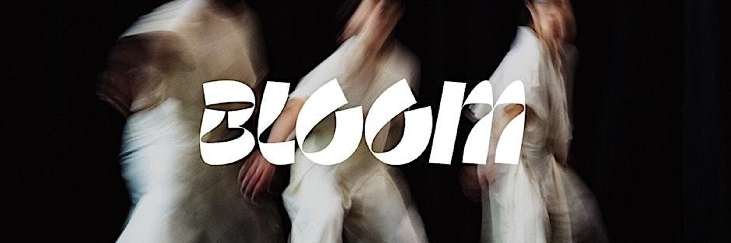 Blurred image of three people wearing white outfits with "BLOOM" written over the top